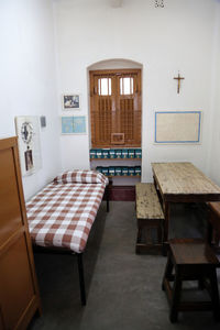 Empty chairs and tables in building