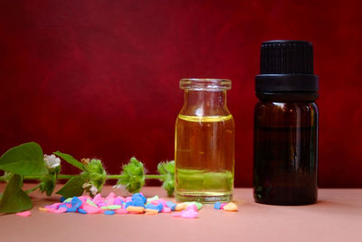 Close-up of flower bottles on table