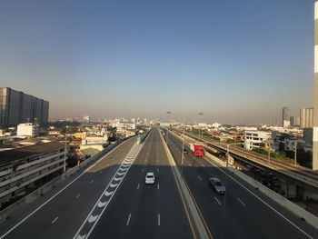 High angle view of vehicles on road against sky