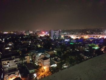 High angle view of illuminated cityscape at night