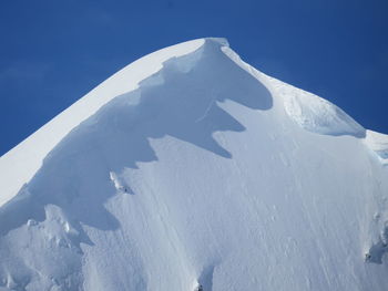 Scenic view of snow covered mountains