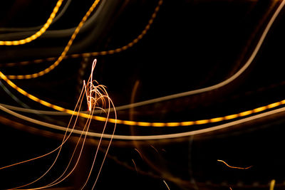 Close-up of light trails against black background