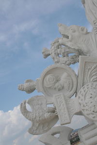 Low angle view of statue against sky