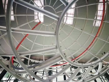 Low angle view of ferris wheel in building