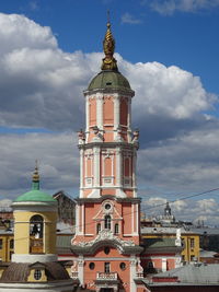 View of tower of building against cloudy sky