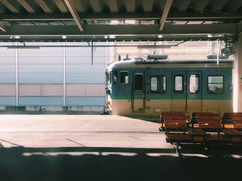 Train at railroad station platform against sky