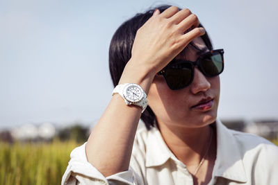 Portrait of young woman wearing sunglasses