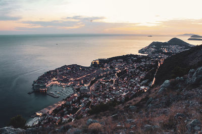 High angle view of sea against sky during sunset