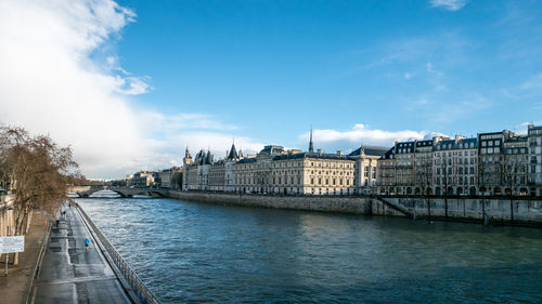 View of bridge over river against cloudy sky