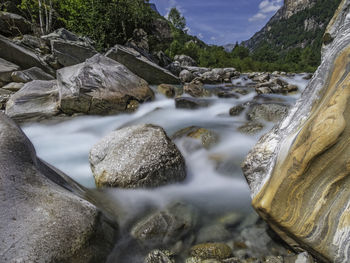 Scenic view of waterfall against sky