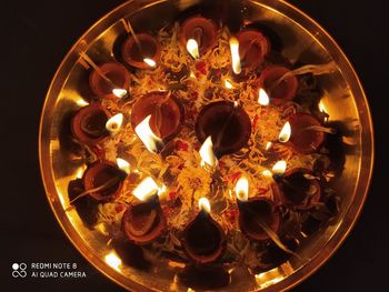 High angle view of illuminated candles