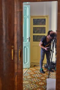 Full length of man photographing at home