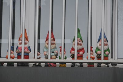 Row of toys on railing