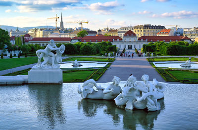 Statue of fountain in front of building