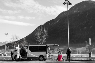 People on car against sky