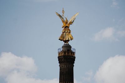 Low angle view of statue against sky