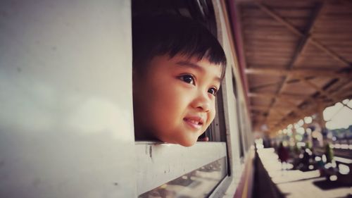 Portrait of cute boy looking away