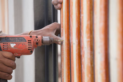 Close-up of man working on wood