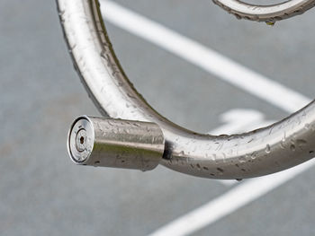 Axe of wheel holder with rain drops. construction of workout equipment outside