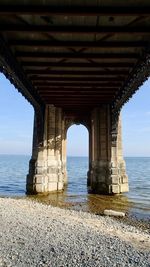 Pier over sea against sky