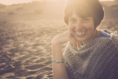 Portrait of smiling young woman at beach