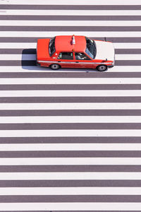 High angle view of taxi on zebra crossing