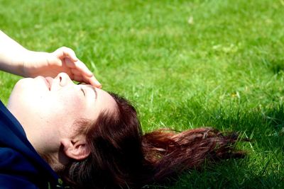 Close-up of man on grassy field