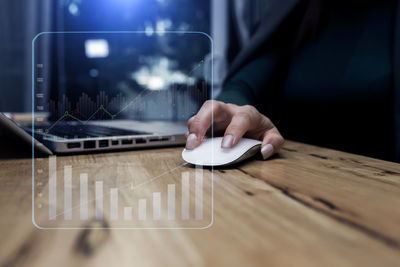 Man using mobile phone on table