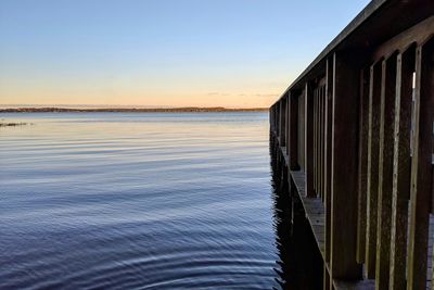 Scenic view of sea against clear sky during sunset