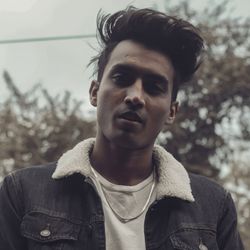 Portrait of young man standing outdoors