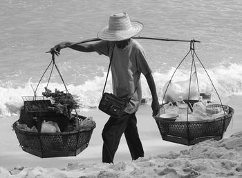 Man with fishing boat in water