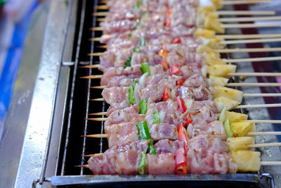 High angle view of meat on barbecue grill