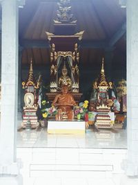 Statue in temple outside building