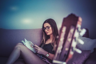 Low angle view of woman using mobile phone