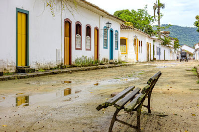 Dirt street wet by rain and colonial-style houses in the old and historic city of paraty