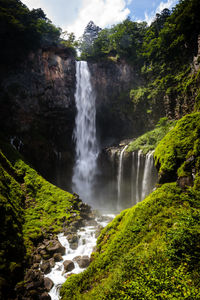 Scenic view of waterfall in forest