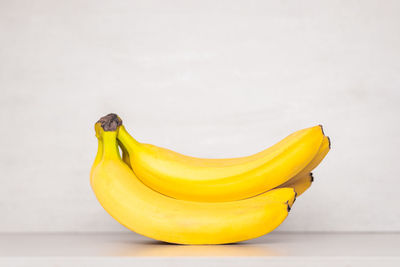 Close-up of yellow fruit against white background