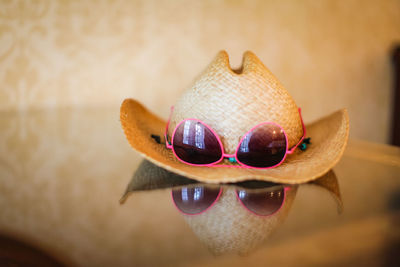 Close-up of man wearing sunglasses on table