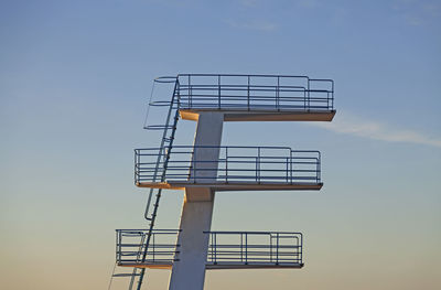 Swimming jumping tower in sunset