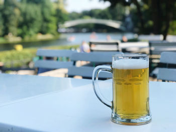 Close-up of beer glass on table