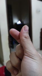 Close-up of hand gesturing at home