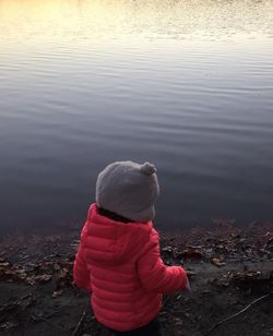 Rear view of girl looking at lake