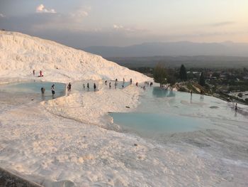 People at pamukkale during sunset