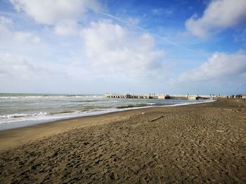 Scenic view of beach against sky