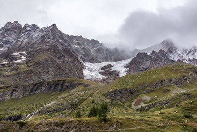 Scenic view of rocky mountains against sky