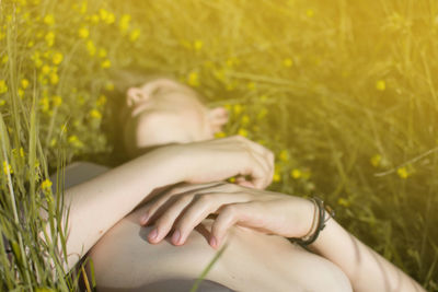 Young boy relaxing on grassy field