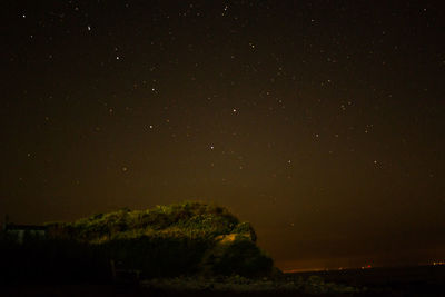 Scenic view of star field against sky at night