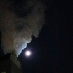 Low angle view of moon in sky at night