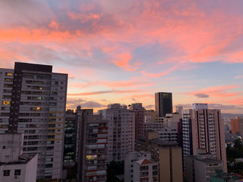 Buildings against sky during sunset