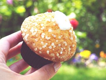 Close-up of hand holding ice cream